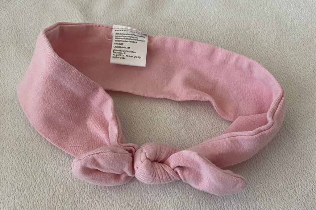 Rosa Baby Stirnband mit Schleife flach liegend elastisches Haarband aus weichem Stoff für Kinder
