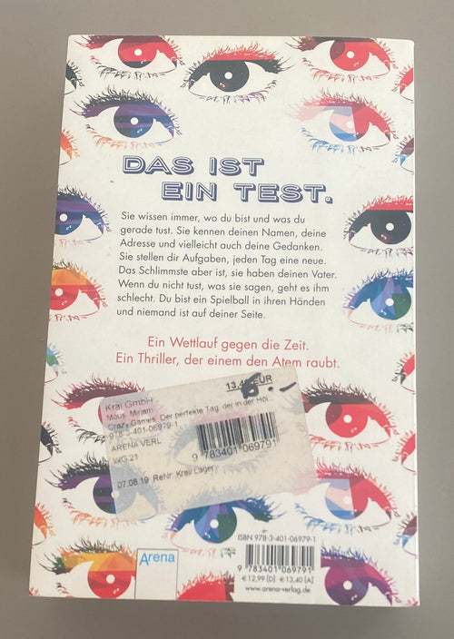 Mirjam Mous Crazy Games Jugendthriller Taschenbuch gebraucht mit buntem Augenmotiv auf weißem Cover und Arena Verlag Logo Rückansicht
