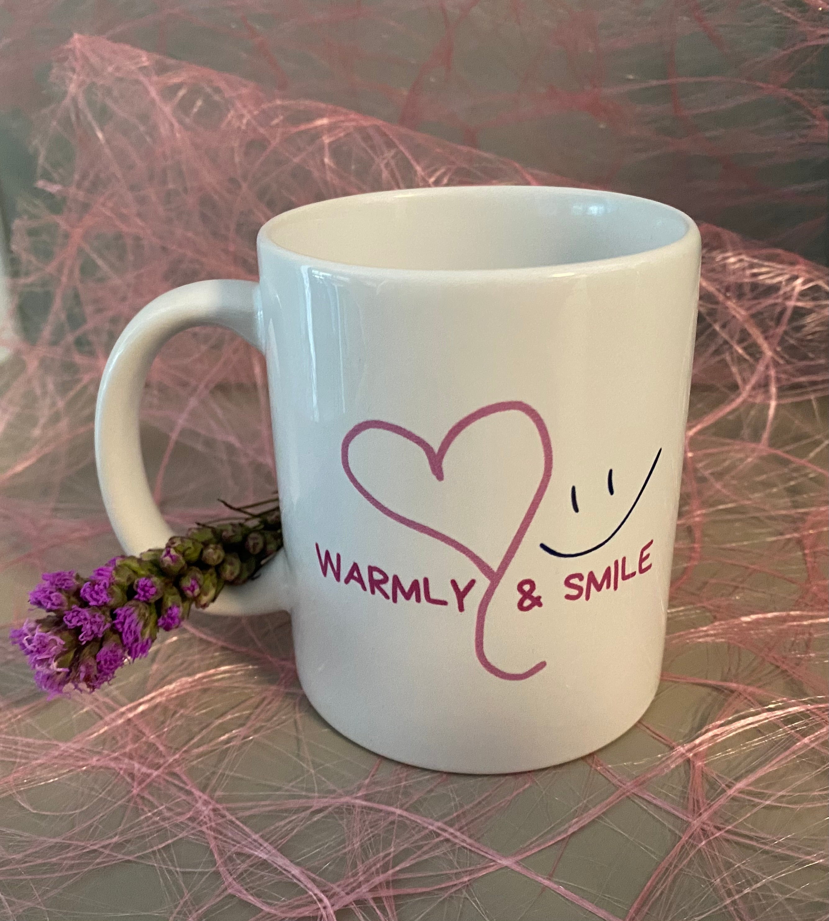 Kaffe- und Teetasse „warmly & smile - Neu