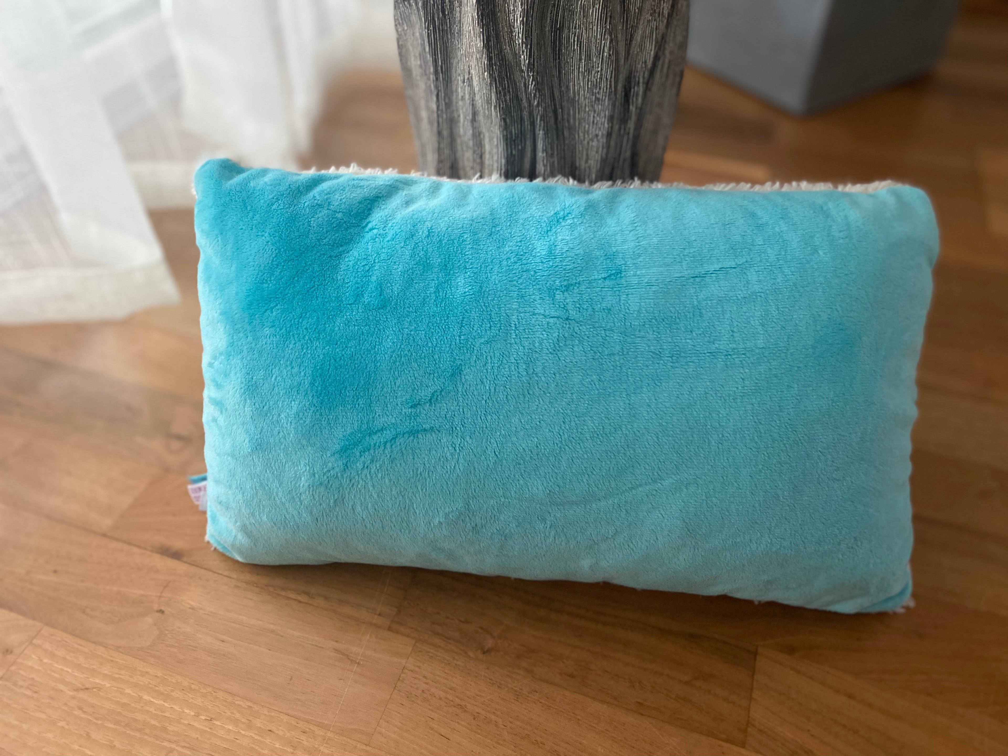 Original NICI Einhorn Kuschelkissen aus cremefarbenem Plüsch mit türkisfarbener Mähne
Rückseite