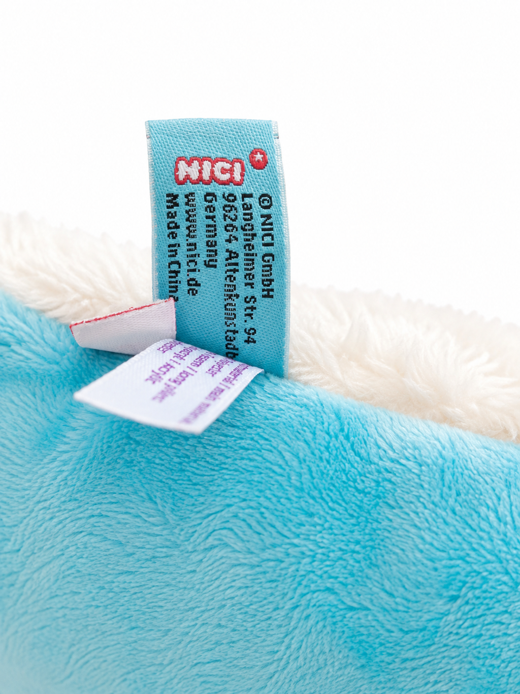Original NICI Einhorn Kuschelkissen aus cremefarbenem Plüsch mit türkisfarbener Mähne
Logo