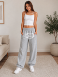 Graue REVIEW Jogginghose in Größe XS mit Logo-Print auf der Vorderseite – Second Hand