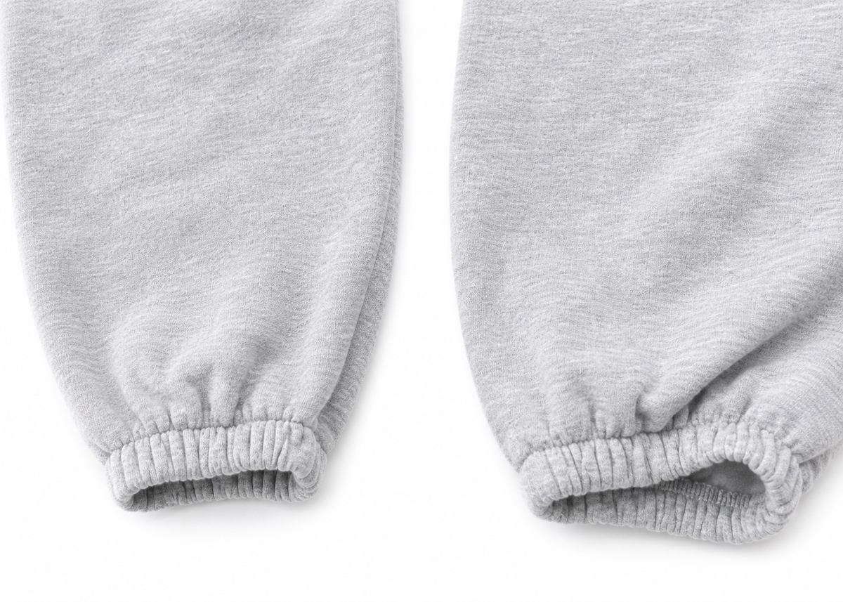 Graue REVIEW Jogginghose in Größe XS mit Logo-Print auf der Vorderseite – Second Hand Hosenbein