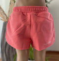 Tommy Hilfiger Sweatshorts für Mädchen in Koralle, Größe 116, mit elastischem Bund und Logo am Bein.